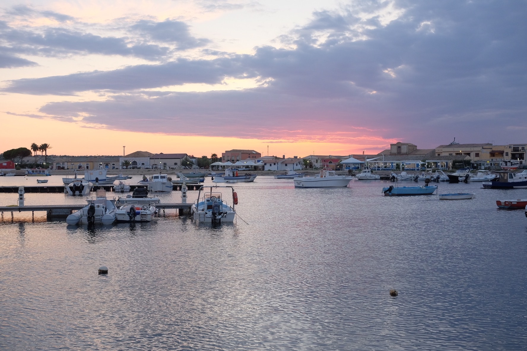 sunset at the harbour in Marzamemi