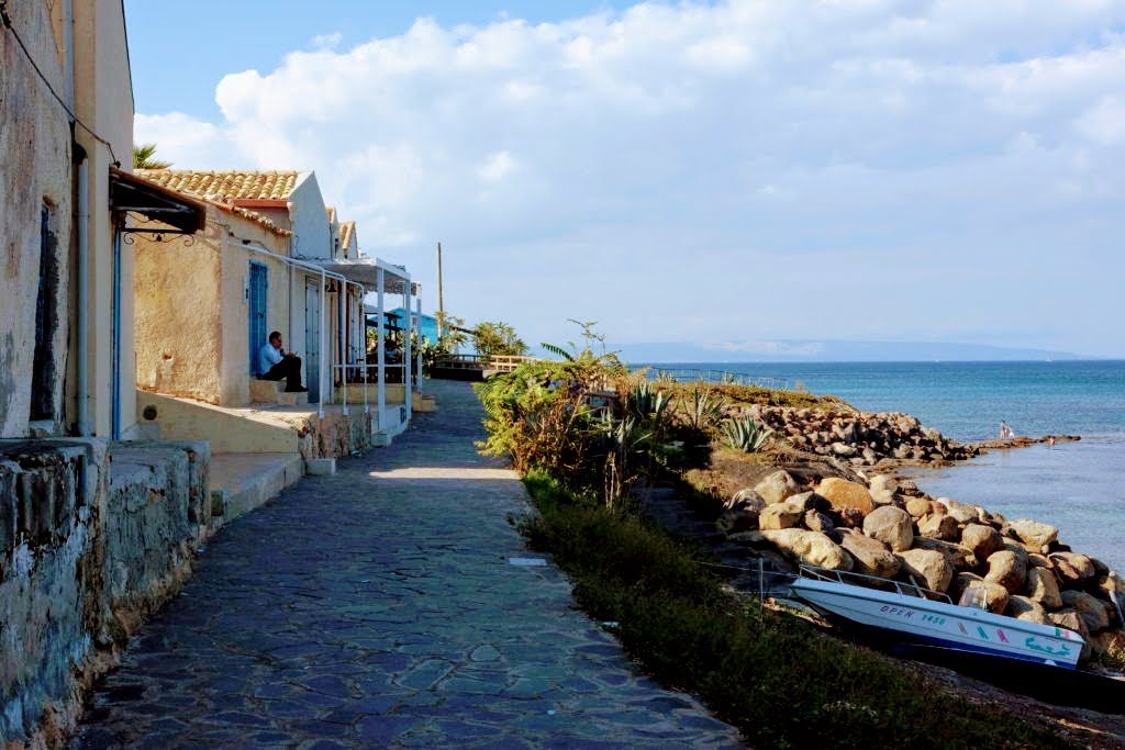 Tiny fishermen houses facing the sea in Portopalo