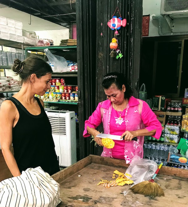 Buying pineapple at the market