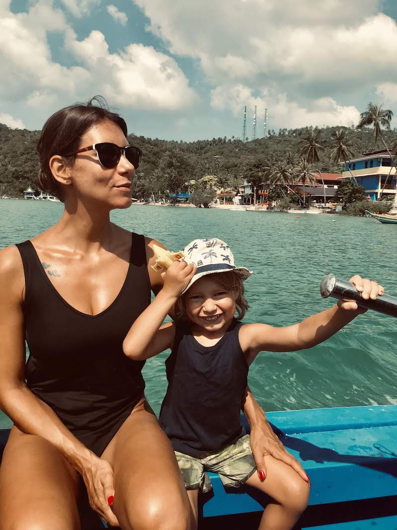 Kid and mum on a motorboat at Koh Tao