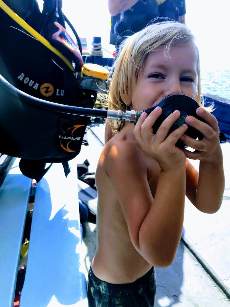 Kid trying diving regulator at Koh Tao