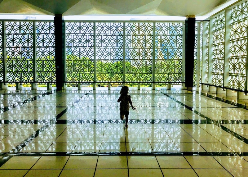 Running inside the huge Masjid Negara Mosque Kuala Lumpur