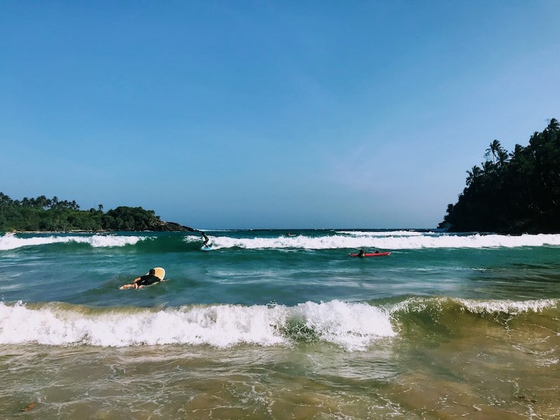 Surfing at Hiriketiya beach